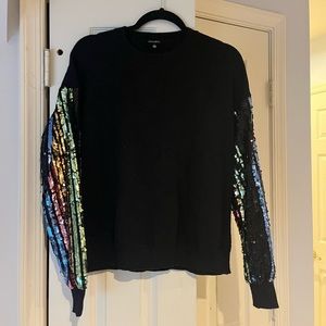Racheal black sweater with rainbow striped sequin sleeves. Size large